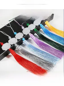 Detailed view of silk tassels with lotus carved beads for DIY Chinese style bookmarks