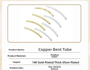Macro detail of 14K gold and silver plated copper curved tube beads for DIY jewelry making
