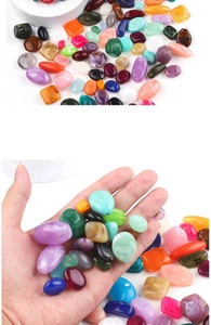 Macro view of colorful acrylic irregular beads for DIY jewelry with marble texture