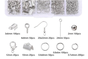 Macro detail of silver DIY jewelry making kit components in a 10-grid storage box