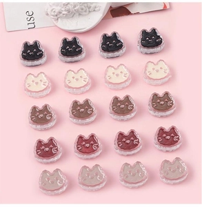 Macro shot of cute acrylic cat beads in five colors for DIY jewelry and bracelets