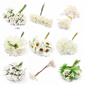 Various white artificial stamens and handmade floral materials for DIY crafts and jewelry