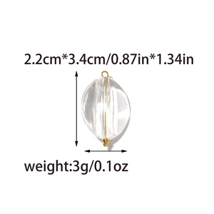 Macro detail of transparent geometric pendant with dimensions and gold needle attachment