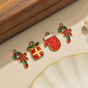 Detailed view of Christmas themed enamel charms for DIY jewelry and accessory making