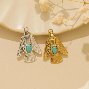 Western turquoise bird pendant in gold and silver finish with detailed wing engravings