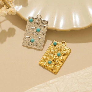 Pendenti vintage in acciaio con motivi floreali e intarsio di turchese in oro e argento