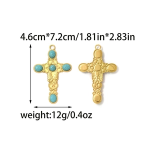 Macro view of gold cross pendant with turquoise beads and retro engraving details