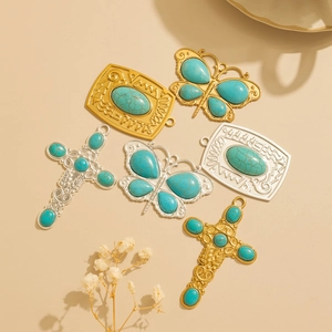 Retro Navajo style turquoise pendants set with butterfly, cross and square charms