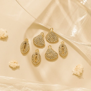 18K gold plated ocean style shell and teardrop charms with micro-pave crystals