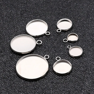 Macro view of 7 assorted sizes of stainless steel round bezel trays for DIY jewelry making
