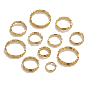 Macro view of gold-plated stainless steel double split rings in various sizes for DIY