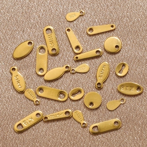 Golden stainless steel jewelry charm tags in various shapes for DIY bracelet making