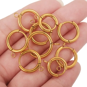 Handheld display of 10 gold-plated round spring clasps for DIY jewelry making and connectors