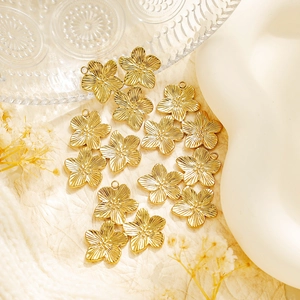 Detail of three-flower gold 304 stainless steel pendants with radiant textures for DIY