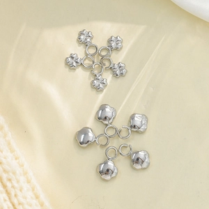 Detail of four-leaf clover stainless steel pendants for DIY jewelry crafting
