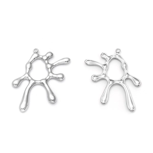Macro detail of irregular liquid metal sun pendants in polished silver stainless steel