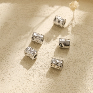 Detail of 304 stainless steel hammer textured cylinder spacer beads for DIY jewelry