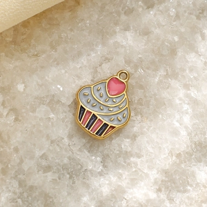 Macro detail of a 304 stainless steel cupcake pendant with enamel drip oil finishing