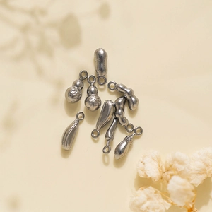 Detailed view of 304 stainless steel vegetable pendants including peanuts and gourds