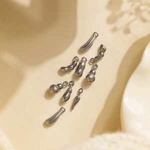 Detailed view of silver stainless steel vegetable pendants with various DIY plant charms