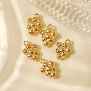 Set of five gold grape-shaped pendants for DIY jewelry making with metallic shine