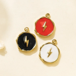 Detailed macro view of 304 stainless steel enamel charms with gold lightning bolt motifs