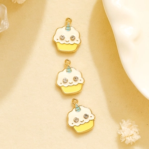 Macro shot of three dripping oil enamel cake charms for DIY jewelry making and crafts