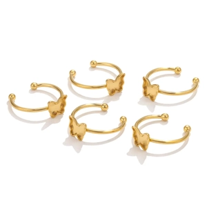Detail shot of five 18K gold plated butterfly ear cuffs on a clean white background