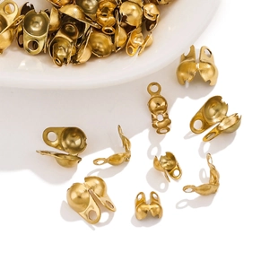 Detailed macro view of matte gold bead tip covers for DIY jewelry necklace making