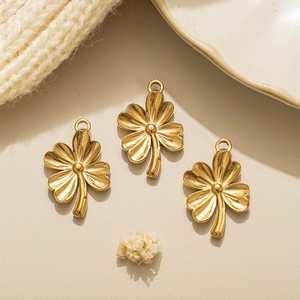 Three 18K gold plated clover pendants with embossed texture for DIY jewelry making