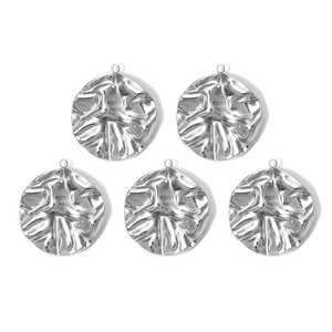 Detailed macro view of 304 stainless steel round textured pendant for jewelry making