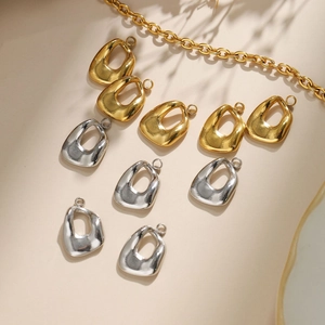 Detailed view of hollow oval pendants in gold and silver finish for DIY jewelry making