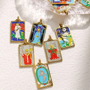 Detail of 304 stainless steel tarot pendants featuring colorful enamel and gold finish