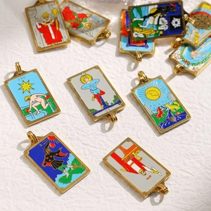 Detail of colorful tarot pendants with enamel oil dripping and gold plated frames