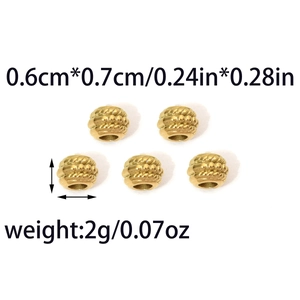 Detail of gold textured stainless steel beads with spiral weave pattern and measurements