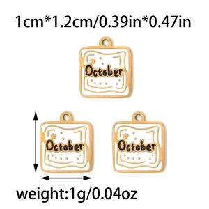 Close-up of three 12mm October birthday charms with white enamel and gold plating