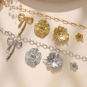 Various 304 stainless steel flower and bow pendants with textured metal chains