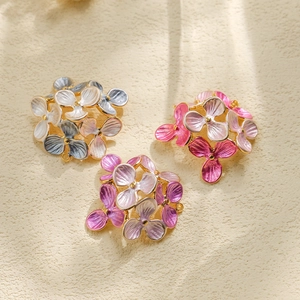 Detailed macro view of 304 stainless steel floral pendants with colorful enamel oil finish