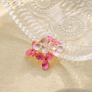 Detail of 304 stainless steel flower pendant with pink and purple enamel gradient finish