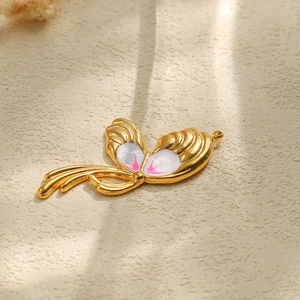 Macro view of 304 stainless steel butterfly wing pendant with hand-painted enamel detail