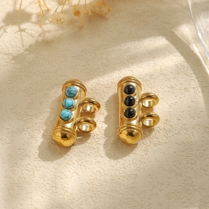 Detail of 304 stainless steel cylindrical charms with turquoise and black onyx inlays