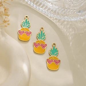 Three pineapple charms with pink heart glasses and colorful enamel for DIY jewelry