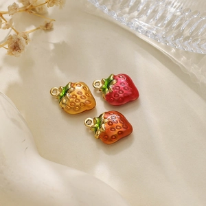 Macro shot of 304 stainless steel strawberry pendants with colorful enamel finish
