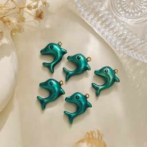 Detailed view of 304 stainless steel dolphin pendants with emerald enamel for DIY jewelry