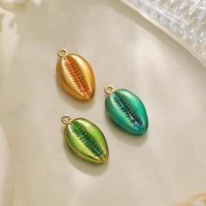 Three colorful cowrie shell pendants in orange, blue, and green for DIY jewelry making