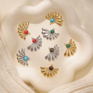 Detailed macro of fan-shaped 304 stainless steel pendants with turquoise and stone inlays