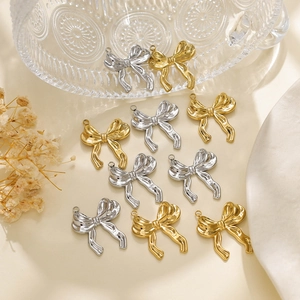 Polished 304 stainless steel bow pendants in gold and silver colors for DIY jewelry