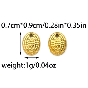 Macro view of 0.7x0.9cm gold oval stainless steel stud earrings with dot texture
