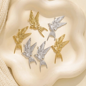 Minimalist 304 stainless steel flying bird pendants in gold and silver finishes