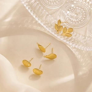 Macro shot of 304 stainless steel geometric gold flower leaf earrings for DIY jewelry